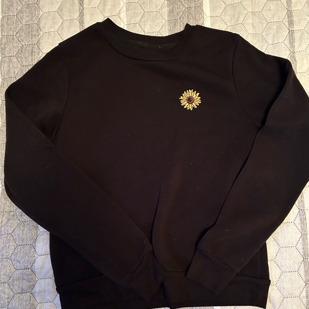 Black sweater with small embroidered sunflower